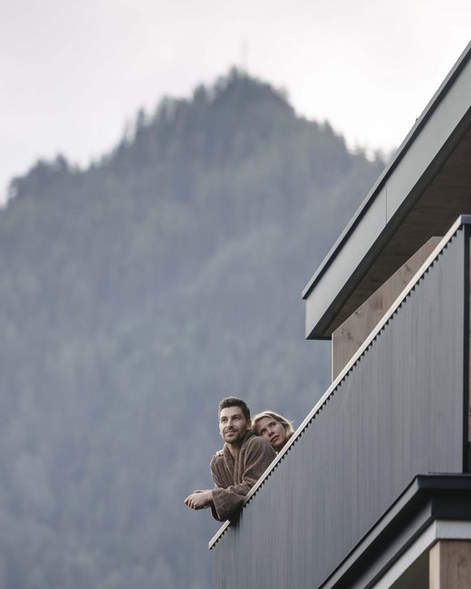 Looking for a hotel in Prutz? Couple on balcony with mountain view in the background